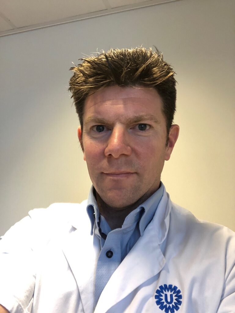 Portrait of a man in white doctor's coat